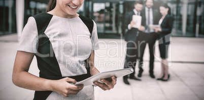 Businesswoman holding digital tablet