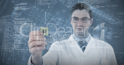 Composite image of engineer holding computer chip
