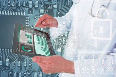 Composite image of doctor using digital tablet