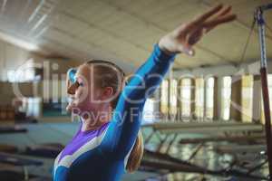 Female gymnast practicing gymnastics