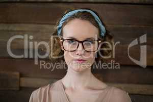 Confident female business executive standing in office