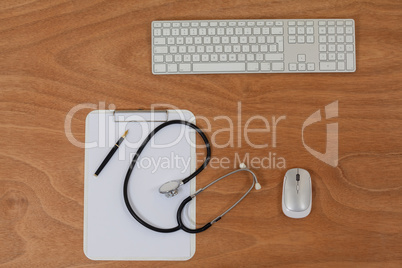 Clipboard with keyboard and mouse on table