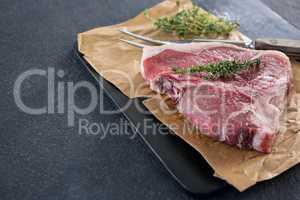 Sirloin chop and fork on slate plate