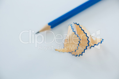 Close-up of blue pencil shavings with pencils