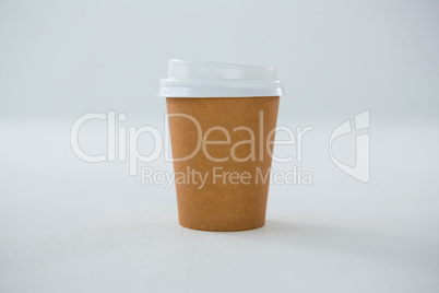 Disposable coffee cup on white background