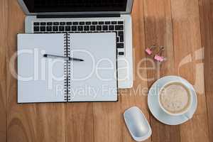 Coffee with organizer and laptop