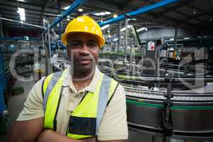 Portrait of confident factory worker at factory