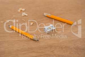 Broken yellow pencil with sharpener