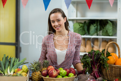 Woman vendor standing at the counter in grocery store