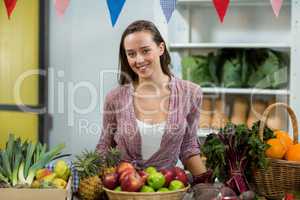 Woman vendor standing at the counter in grocery store