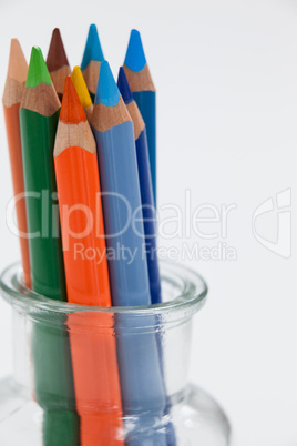 Close-up of colored pencils kept in a glass jar