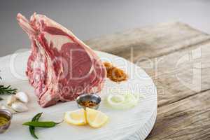 Rib chop and ingredients on white board