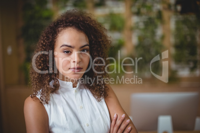 Female executive standing in office