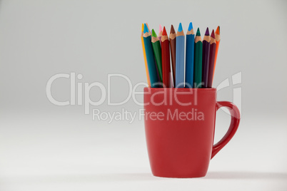 Colored pencils kept in cup