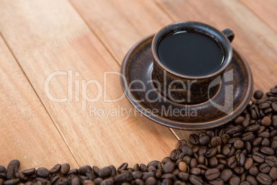 Black coffee with roasted coffee beans