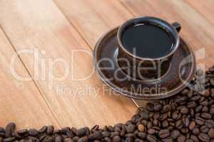 Black coffee with roasted coffee beans