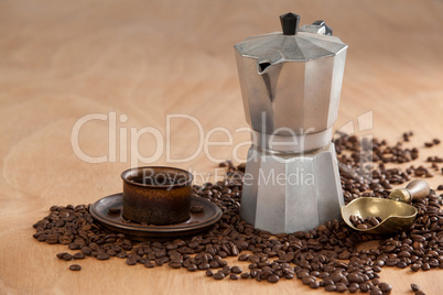 Coffee beans, coffee, coffeemaker and scoop