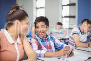 Student using mobile phone in classroom