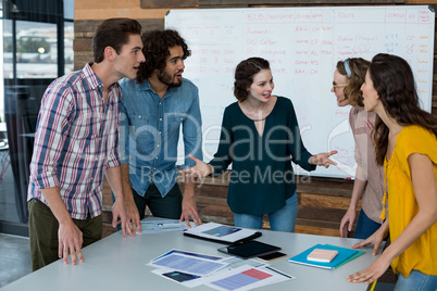 Business executives discussing with each other in meeting