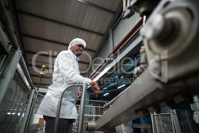 Factory engineer monitoring production line