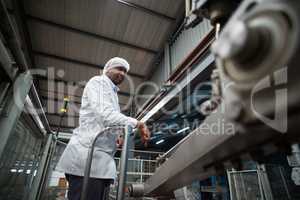 Factory engineer monitoring production line