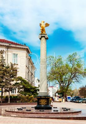 Griffin sculpture on a pedestal