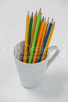 Colored pencils kept in cup