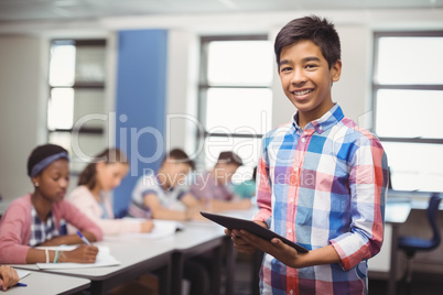 Schoolboy giving presentation in classroom