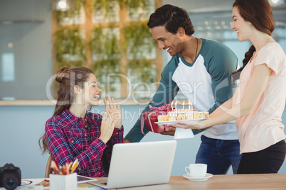 Executives celebrating their colleagues birthday