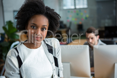 Happy woman standing in office