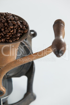 Vintage coffee grinder with coffee beans