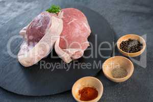 Sirloin chop and bowls of spices