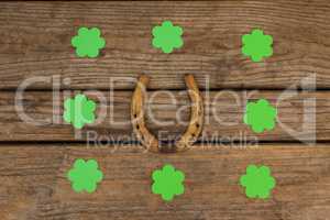 St Patricks Day shamrocks surrounded with horseshoe