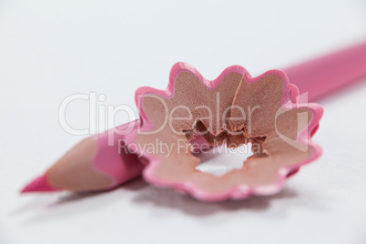 Close-up of pink colored pencil with shavings