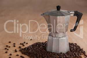 Metallic coffee maker with coffee beans