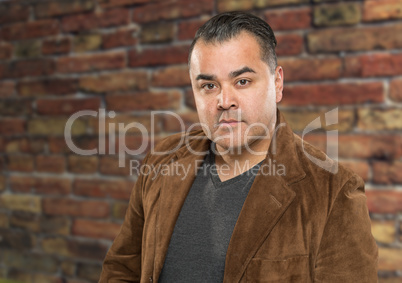 Handsome Young Hispanic Male Headshot Portrait Against Brick Wal