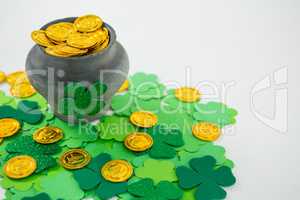 St. Patricks Day shamrocks and pot filled with chocolate gold coins