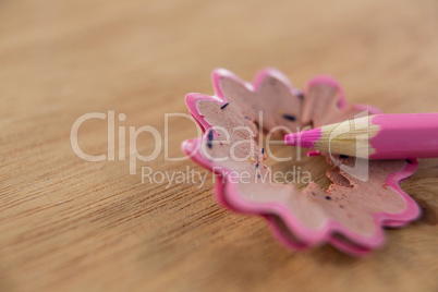 Close-up of pink color pencil with pencil shaving