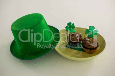 St Patricks Day leprechaun hat with shamrock on cupcake