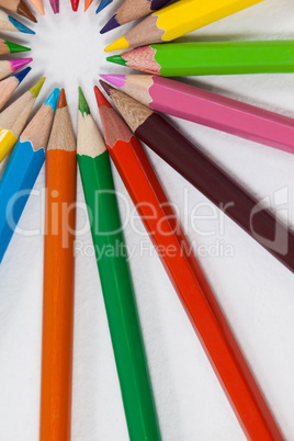 Close-up of colored pencils arranged in a circle