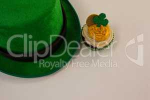 St Patricks Day leprechaun hat with shamrock on cupcake