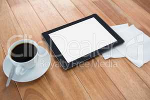 Coffee with digital tablet and paper