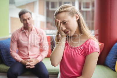 Teacher scolding student in library