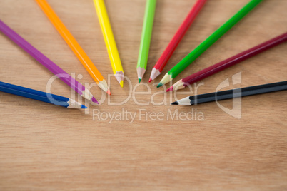 Colored pencils arranged in semi circle
