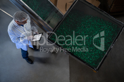 Factory engineer using digital tablet in the factory