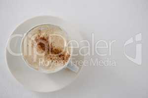 Close-up of coffee cup with creamy froth