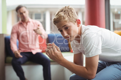 Teacher scolding student in library