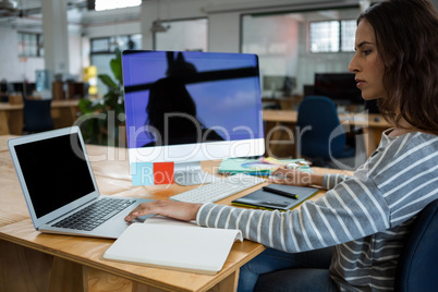 Female graphic designer working at desk