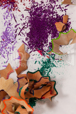 Sharpener and various colored pencil shavings