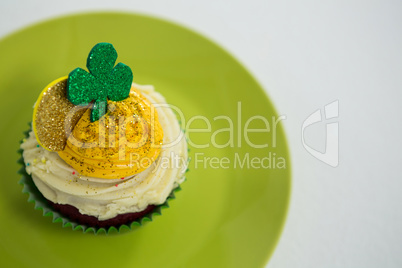 St Patricks Day shamrock on the cupcake kept in plate